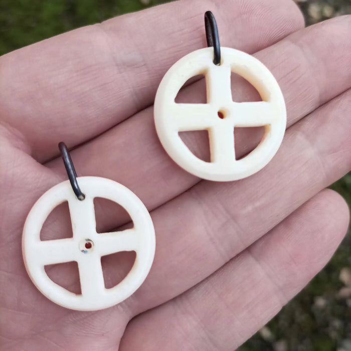 Bone Sun Cross Odin Pendants on Hand