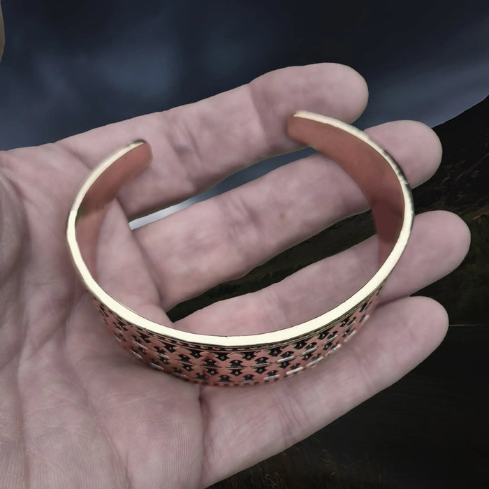 Bronze Hiberno-Norse Viking Bracelet / Arm Ring Replica with 1 Dot Design on Hand - Above Angle View