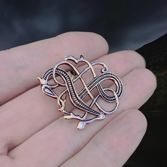 Bronze Urnes Dragon Viking Brooch Replica from 11th Century Iceland on Hand - Angle View