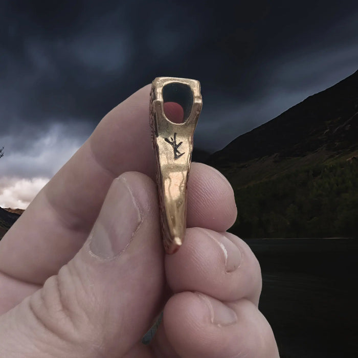 Bronze Knotwork Axe Head Pendant in Hand - Underside View