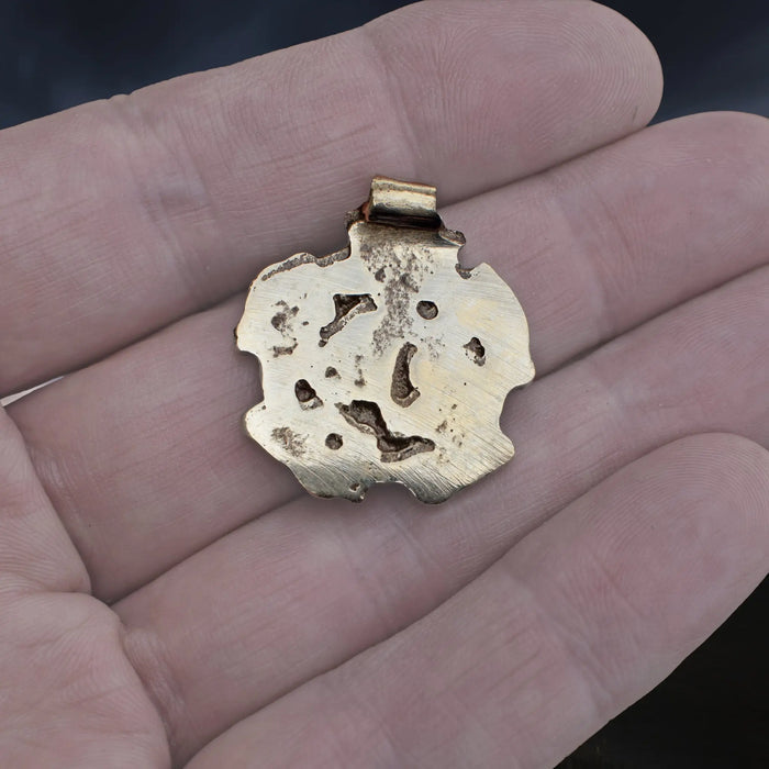 Solid Bronze Replica Viking Gripping Beats Pendant from&nbsp; 10th century Sweden on Hand - Back View
