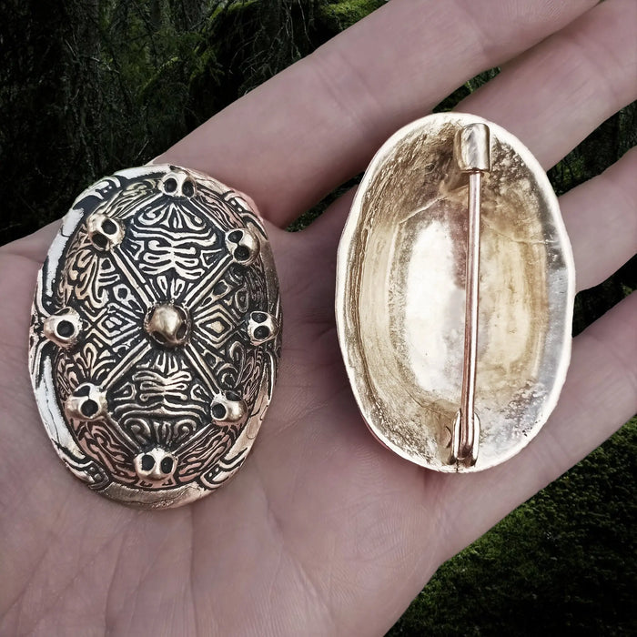 Bronze Viking Tortoise Brooches from Aland in Hand - Front and Back