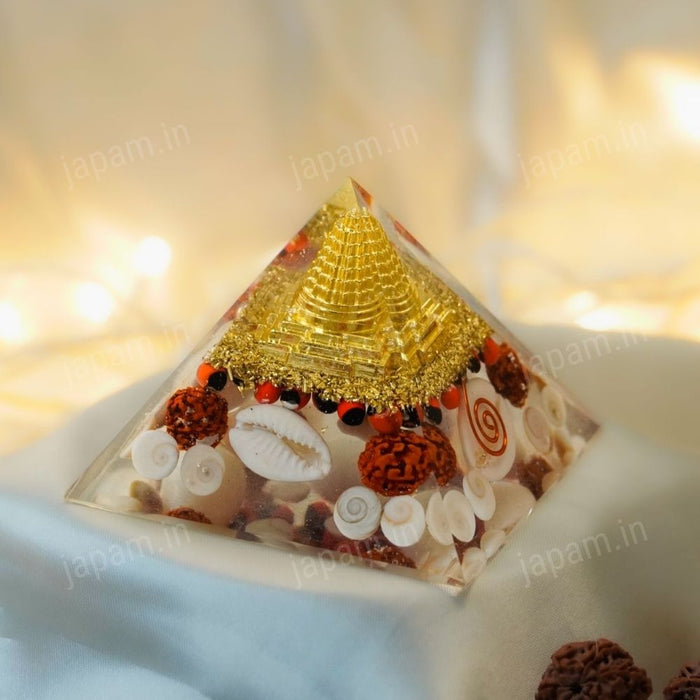 Golden Lakshmi Money Magnet Pyramid with Rudraksha, Shree Yantra, Gomti Chakra & White Kaudi for Vaastu
