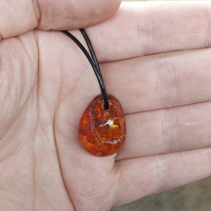Amber Amulet Pendant on Hand with Leather Thong - Other Shape