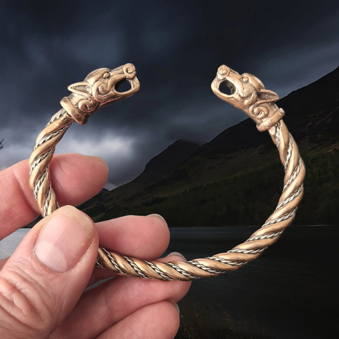 Handmade Twisted Viking Bronze and Silver Bracelet with Ferocious Wolf Heads in Hand