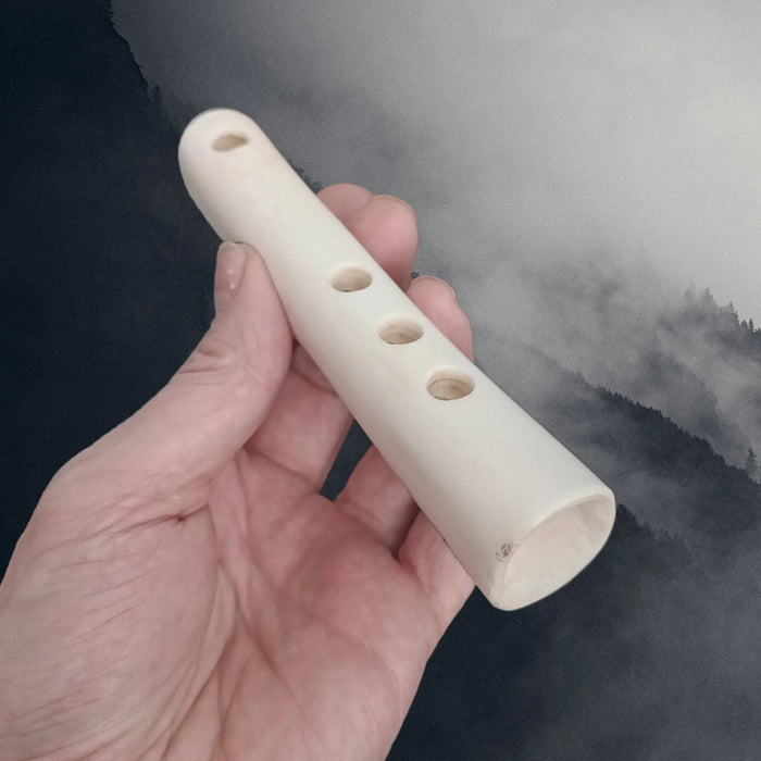 Replica Viking Age Bone Flute in Hand - Angle View