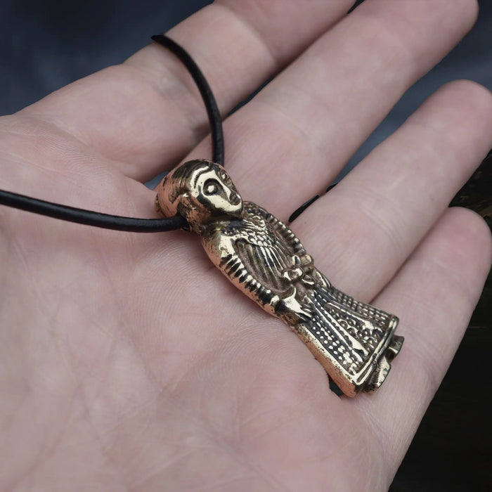 Large Bronze Viking Woman Pendant Replica from Revninge, Denmark on Leather Cord, on Hand - Side Angle View
