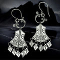 Silver 5 T Rune Norwegian Viking Earrings on Night Coast Background
