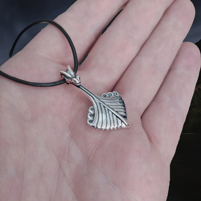 Replica Norwegian Viking Ship Pendant in Sterling Silver on Leather Cord on Hand - Side Angle View