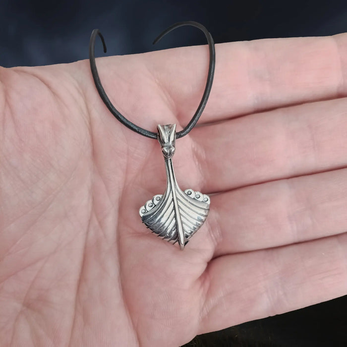 Replica Norwegian Viking Ship Pendant in Sterling Silver on Leather Cord on Hand