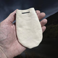 Natural Veg-Tan Leather Viking Pouch with Leather Drawstring Tie on Hand