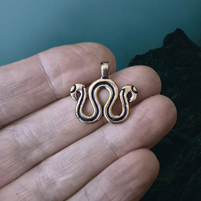 Viking Age Replica Bronze Serpent Bead Divider from Sweden on Hand - Close Up