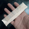Authentic Handmade Replica Viking Bone Comb with Hand-Carved Decorations on Hand