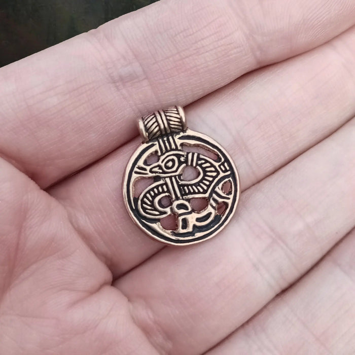 Round Bronze Viking Dragon Pendant from Birka on Hand